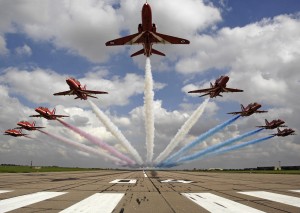Pictured are The Red Arrows performing a low level flypast over 04 threshold at RAF Scampton. The Royal Air Force Aerobatic Team, the Red Arrows, is one of the world's premier aerobatic display teams. Representing the speed, agility and precision of the RAF, the team is the public face of the service. They assist in recruiting to the Armed Forces, act as ambassadors for the United Kingdom and promote the best of British. Flying distinctive Hawk jets, the team is made up of pilots, engineers and essential support staff with frontline, operational experience.
